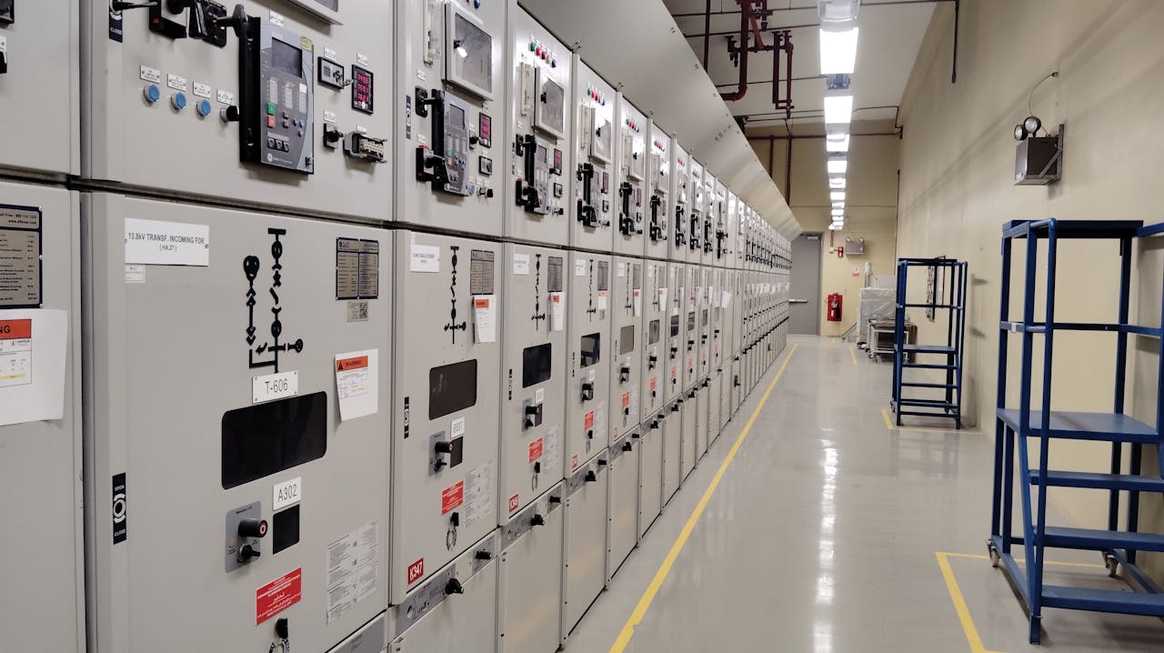 Mastering the First Impression: Your intriguing post title goes here Long row of control panels in an industrial electrical control room, well-lit and spacious.