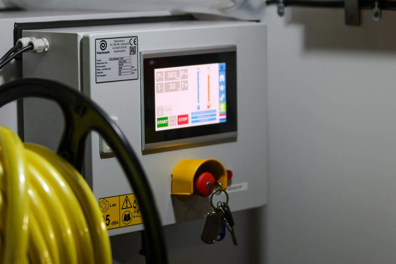 Crafting Captivating Headlines: Your awesome post title goes here Close-up of an industrial control panel displaying safety features and a digital screen.