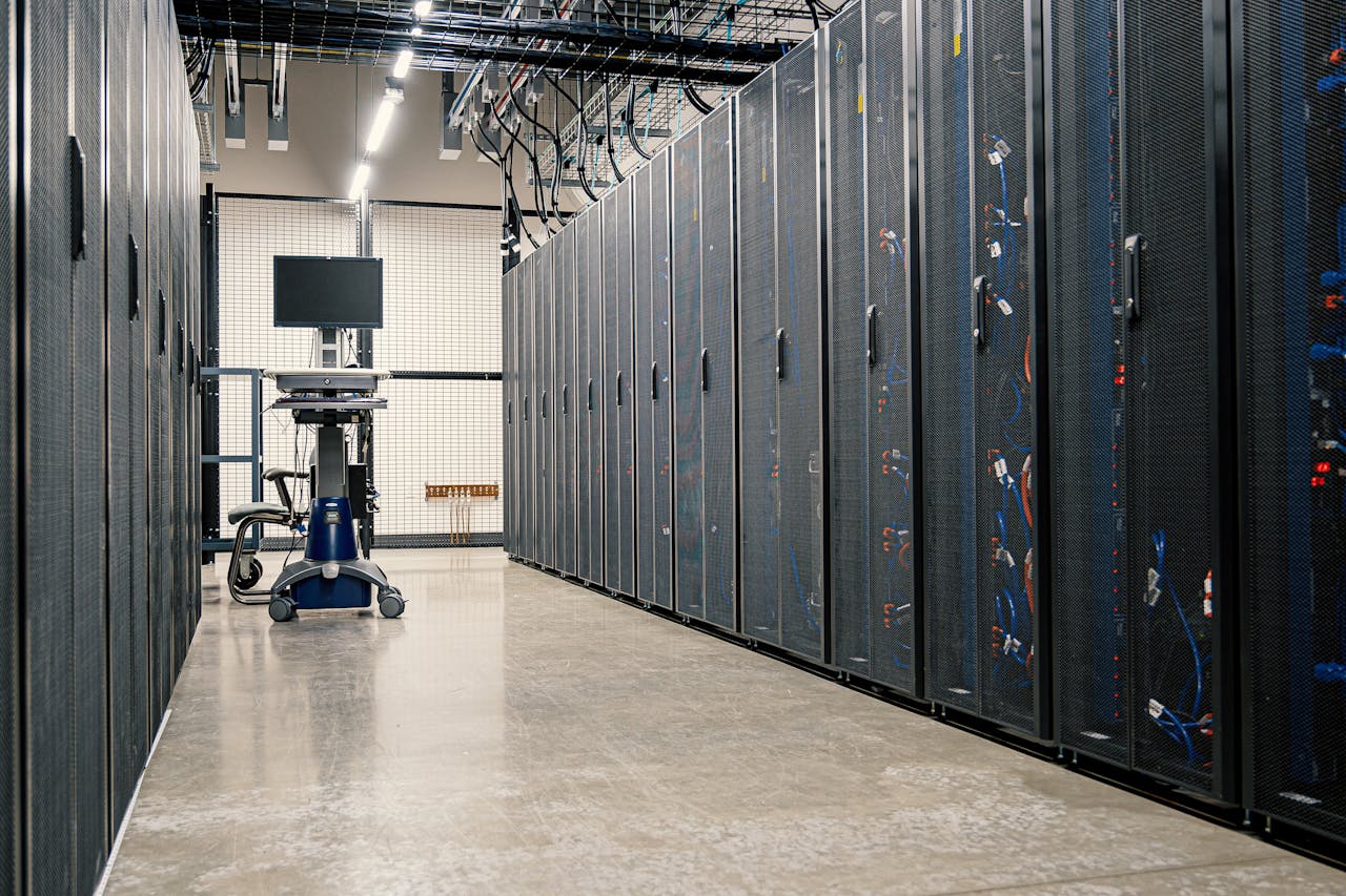 about-us Steel framework cabinets housing servers networking devices and cables in contemporary equipped data center